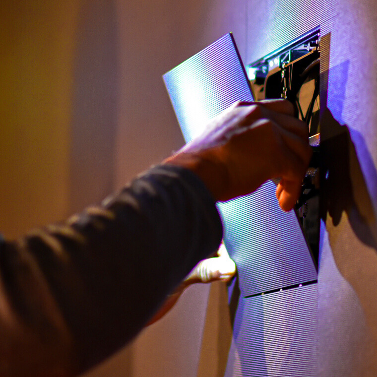 An Electrosonic support technician replacing an LED panel.