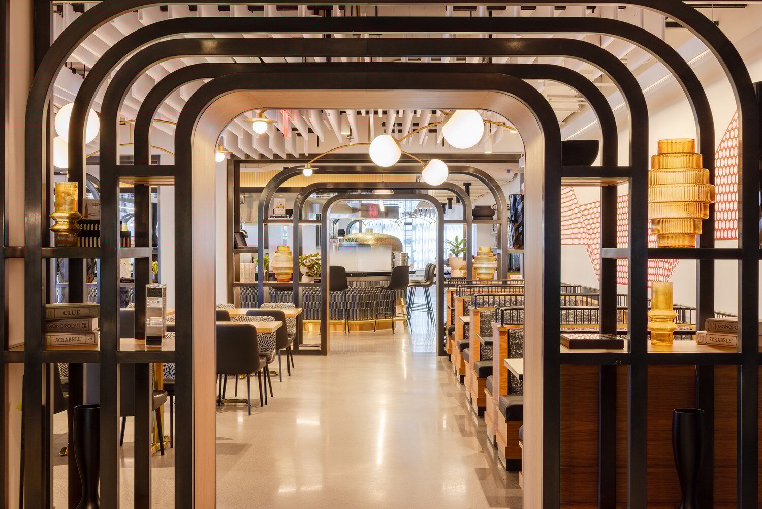Lunchroom that has booths and arches at the entrance and exit