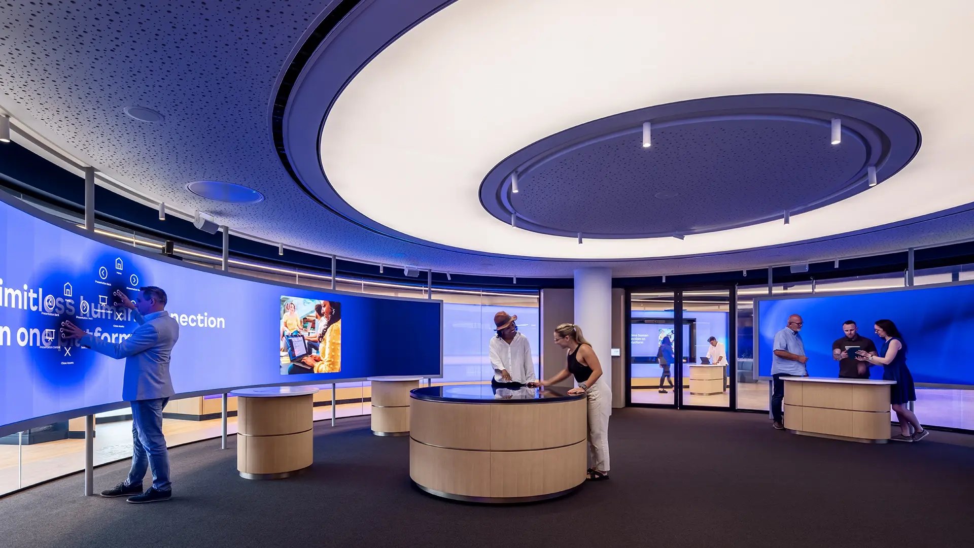 A curved, interactive LED wall welcomes guests to Zoom’s London Experience Center, offering hands-on engagement with the company’s collaboration tools