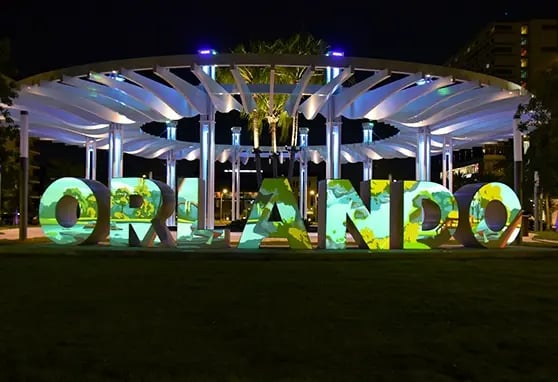 A large projection mapped sign of Orlando.
