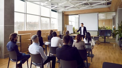 An Electrosonic AV technician leading a training session at a customer site.