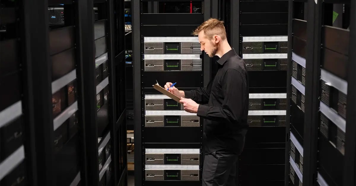 An Electrosonic employee reviewing a systems performance.