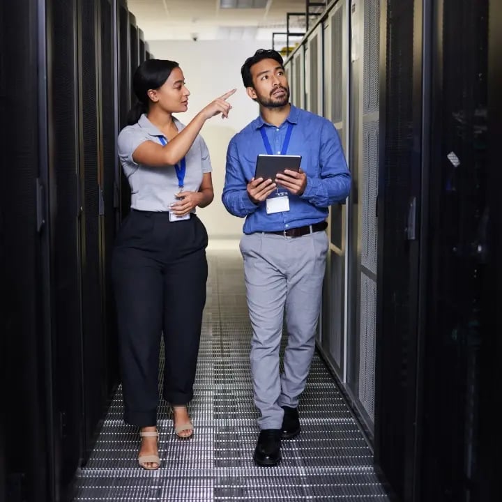 An Electrosonic service representative walking an  employees through an on-site training exercise.web