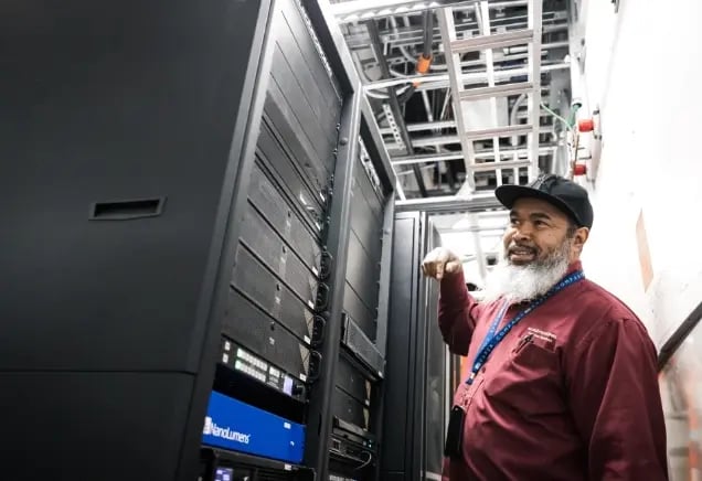 An Electrosonic technician inspects AV equipment onsite to ensure proper performance and reliability.