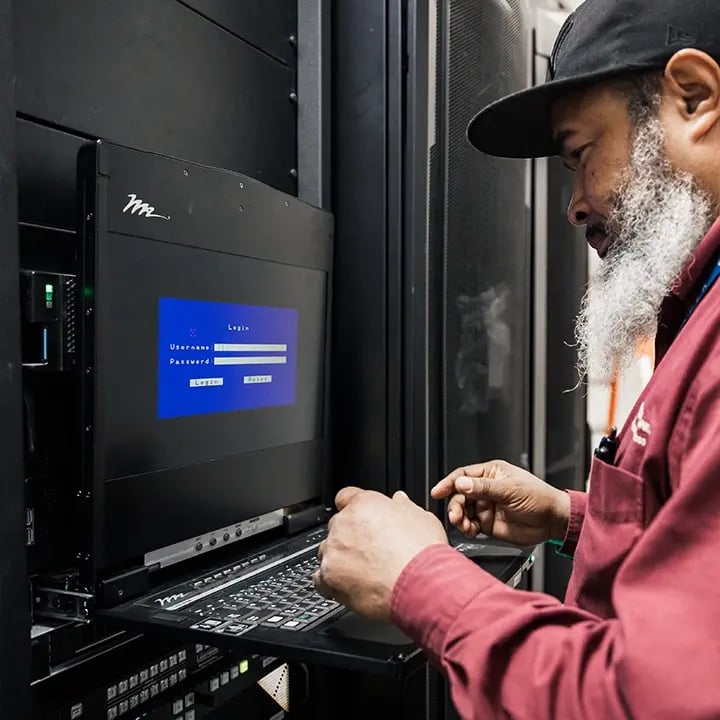 An Electrosonic technician testing a system from the rack room.