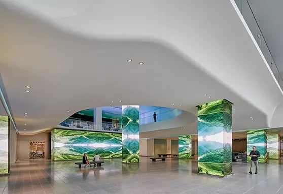 An LED wall in the AT&T headquarters displays real-time analytics and company messaging, serving as a tech-forward focal point in the lobby.