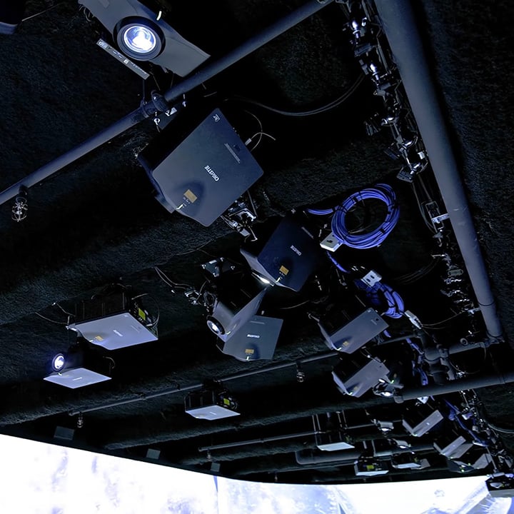 An overheadshot of 30 projectors installed at a customer site.