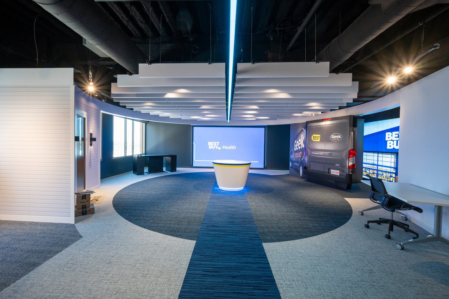 Interior shot of Best Buy Health center with digital display and geek squad. 