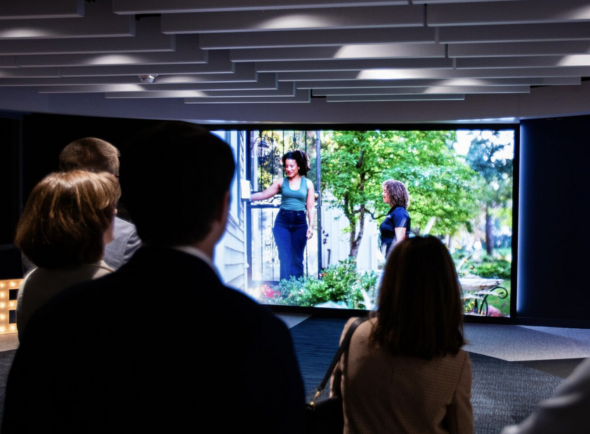 Group of people viewing the LED wall.