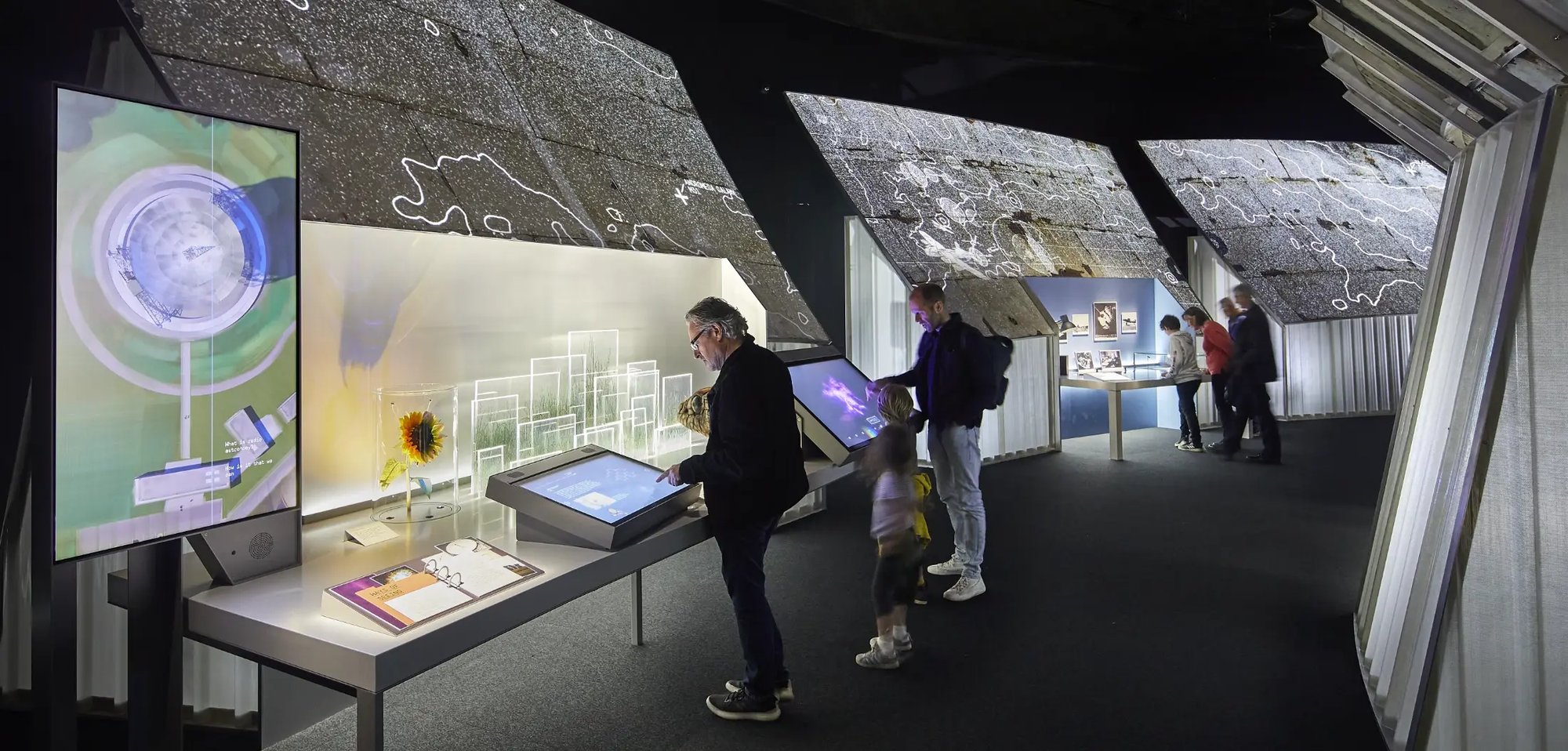 Guests to an Electrosonic designed and engineered experience interacting with the AV installations. 