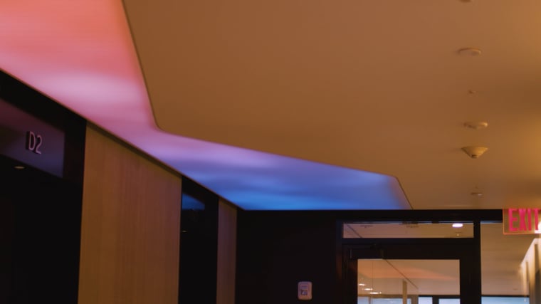 Ceiling with diffused LED lighting creating an open-air feeling indoors through soft, immersive light.