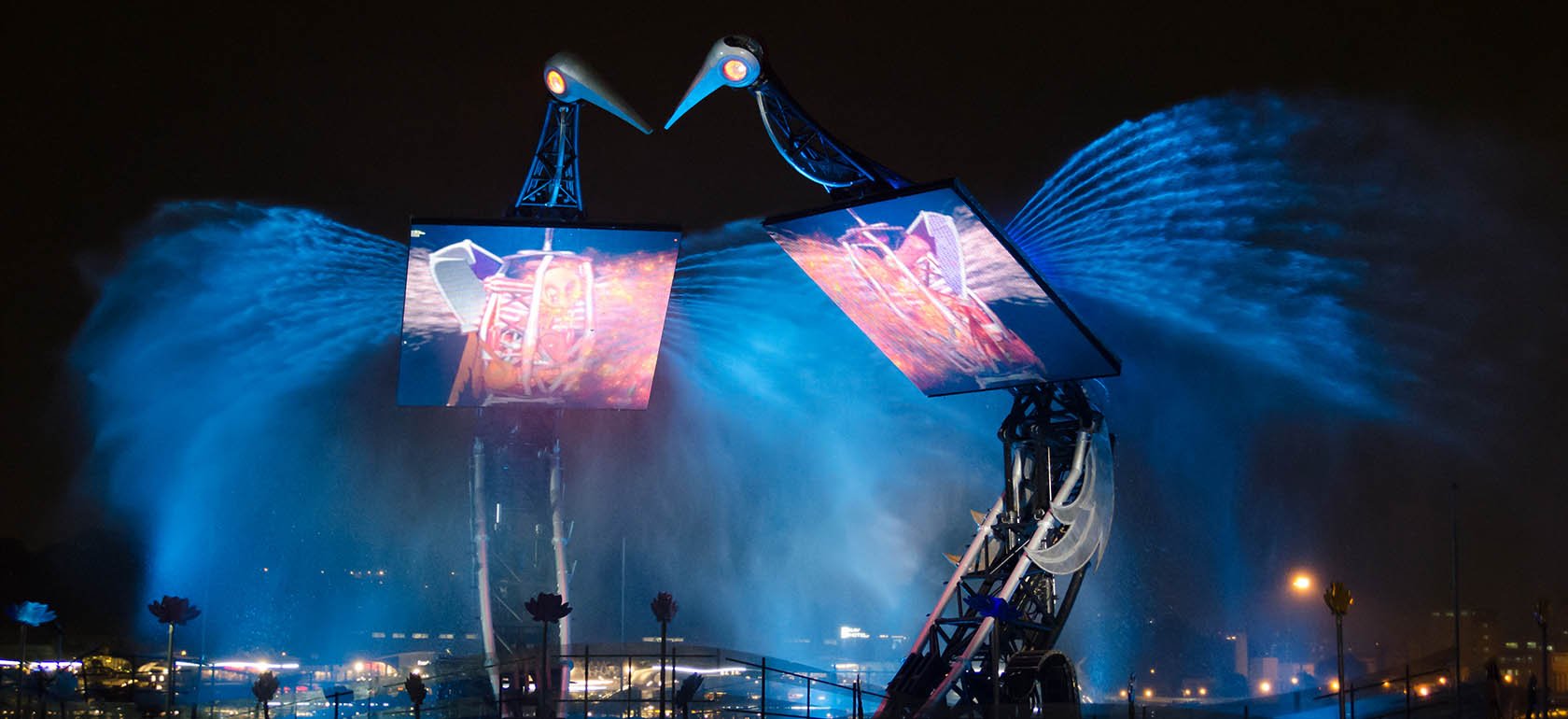 Two large animatronics equipped with LED walls and water/lighting effects.