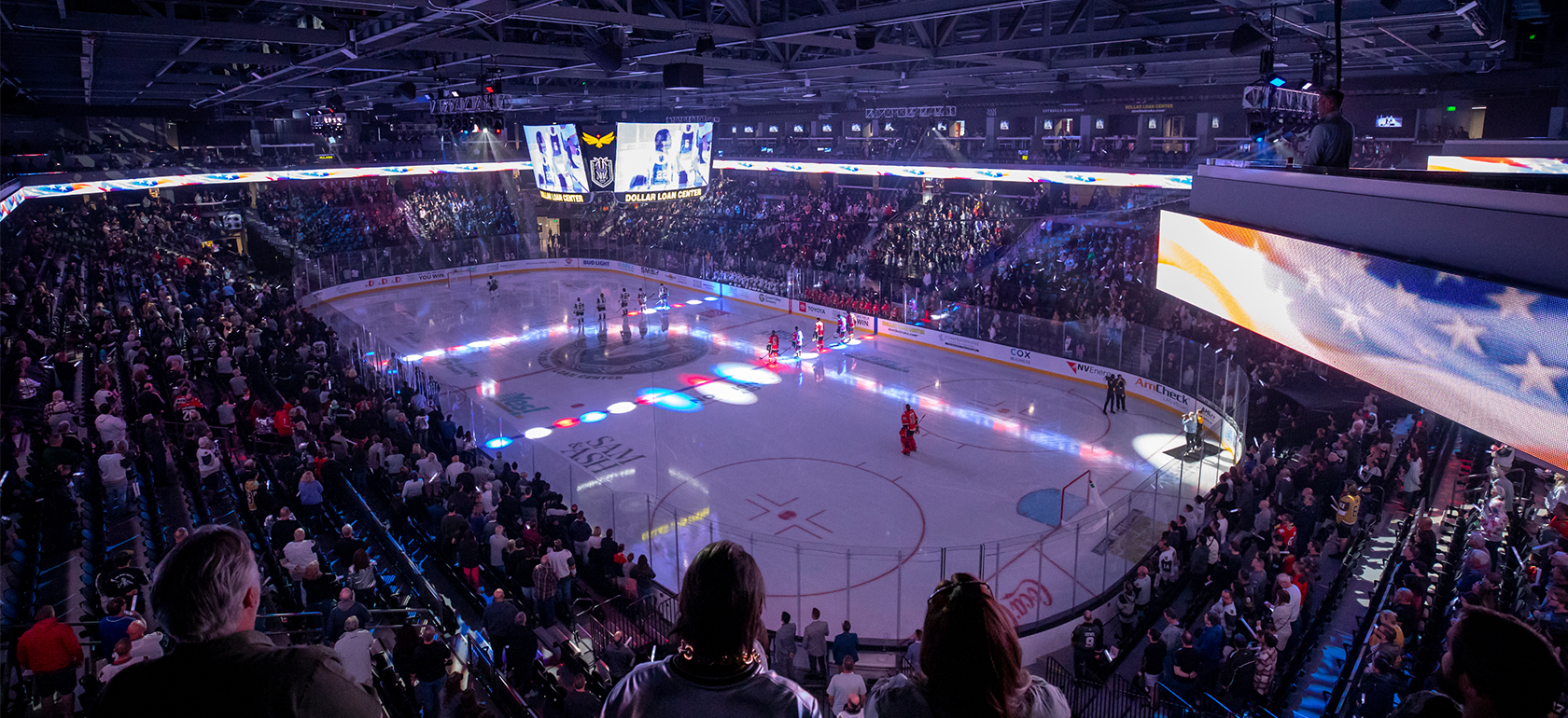 Guests watching an ice hockey game at the Dollar Loan Center.