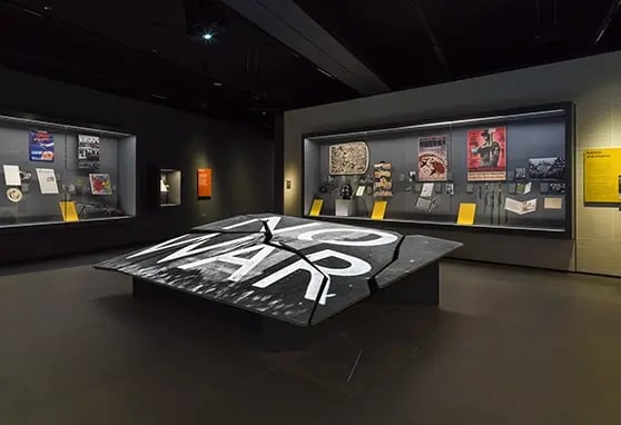 Dynamic projection mapping transforms the museum façade with vivid historical imagery.