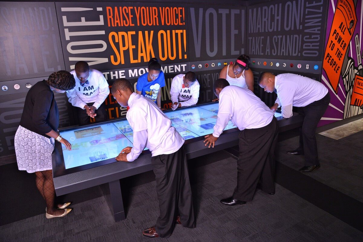 An interactive table is a great way to encourage guests to get involved with an exhibit.