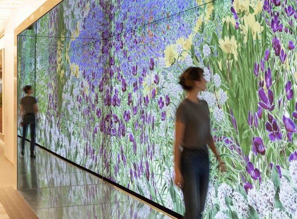 Woman viewing LED wall.