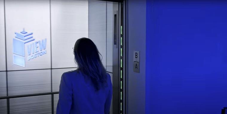 Guest to View Boston walking into the elevator experience.
