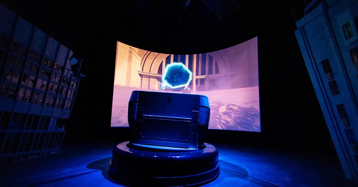 Guests experience the War of the Worlds The Attack ride, surrounded by dramatic lighting, set design and immersive effects that simulate an alien invasion.