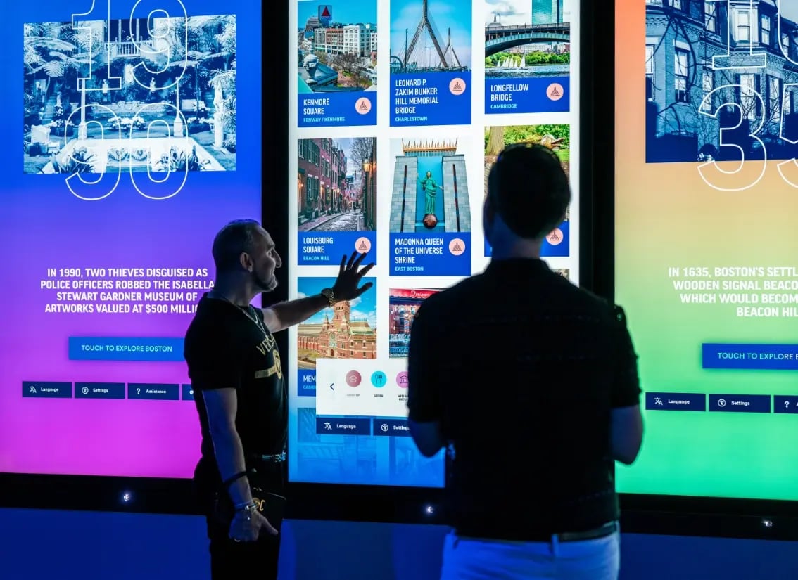 Guests interacting with a large LED wall.