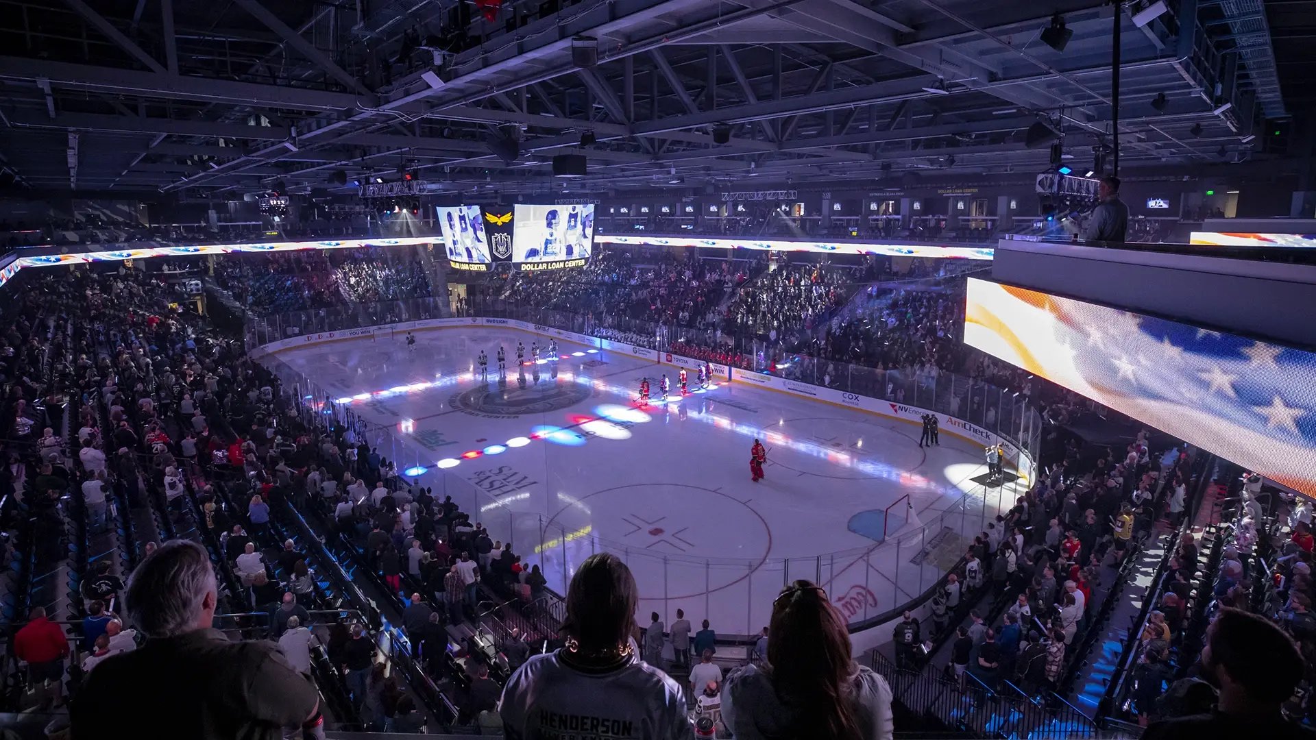 Guests to the Dollar Loan Center in Las Vegas seated in the stands looking down at an Ice Hockey game.