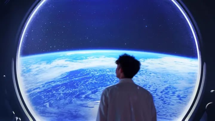 1. A man gazes out of a window, observing the Earth from a distance, with a contemplative expression on his face.