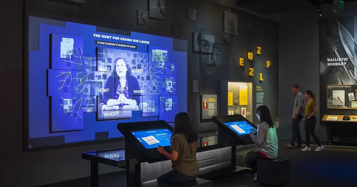 Interactive exhibit at the International Spy Museum featuring dynamic projection displays that engage visitors with immersive spy themed content.