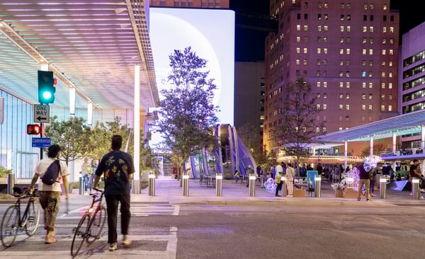 Man walking into the AT&T Discovery District in Dallas. 