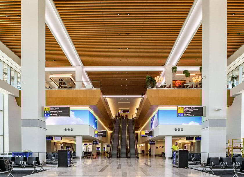 Two twin angled LED walls at LaGuardia Airport.