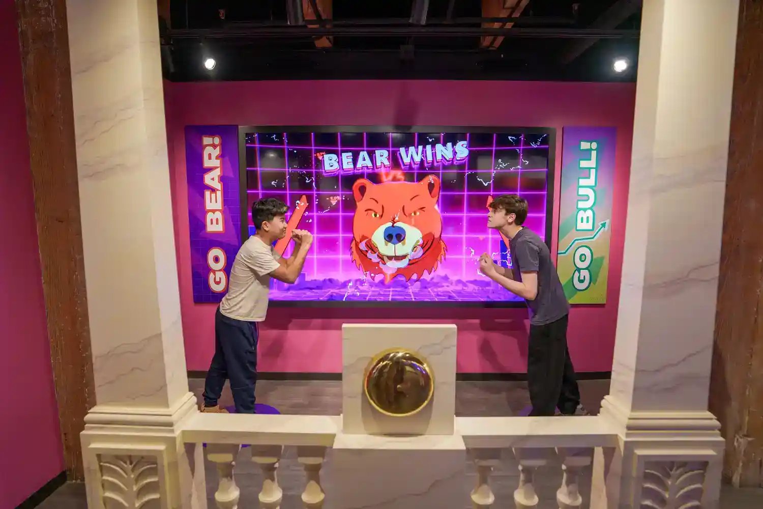 Boys playing with bear and bull interactive.