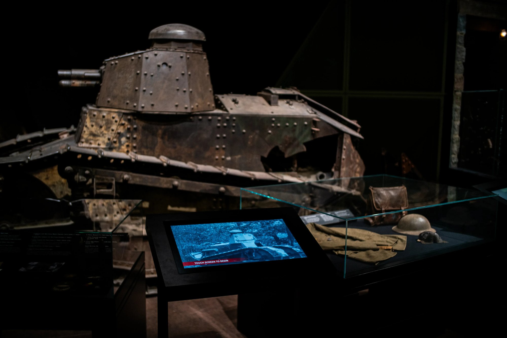 A tank with a screen at the front of the exhibit.