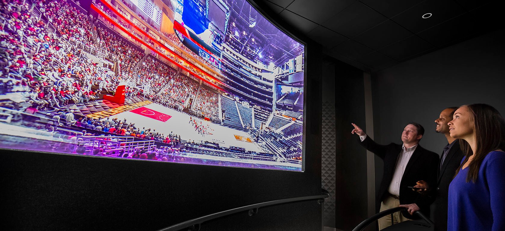 Guests viewing a hawks game on a large video wall at the Atlanta Hawks Preview Center.