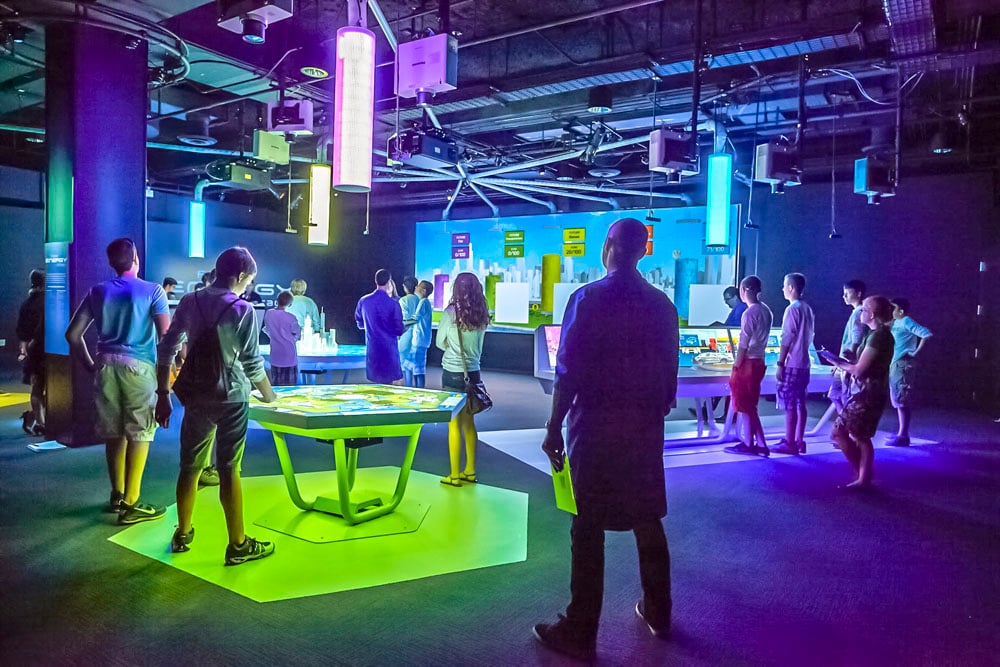 Visitors to the Future Energy Chicago at the Museum of Science & Industry interacting with the various games.