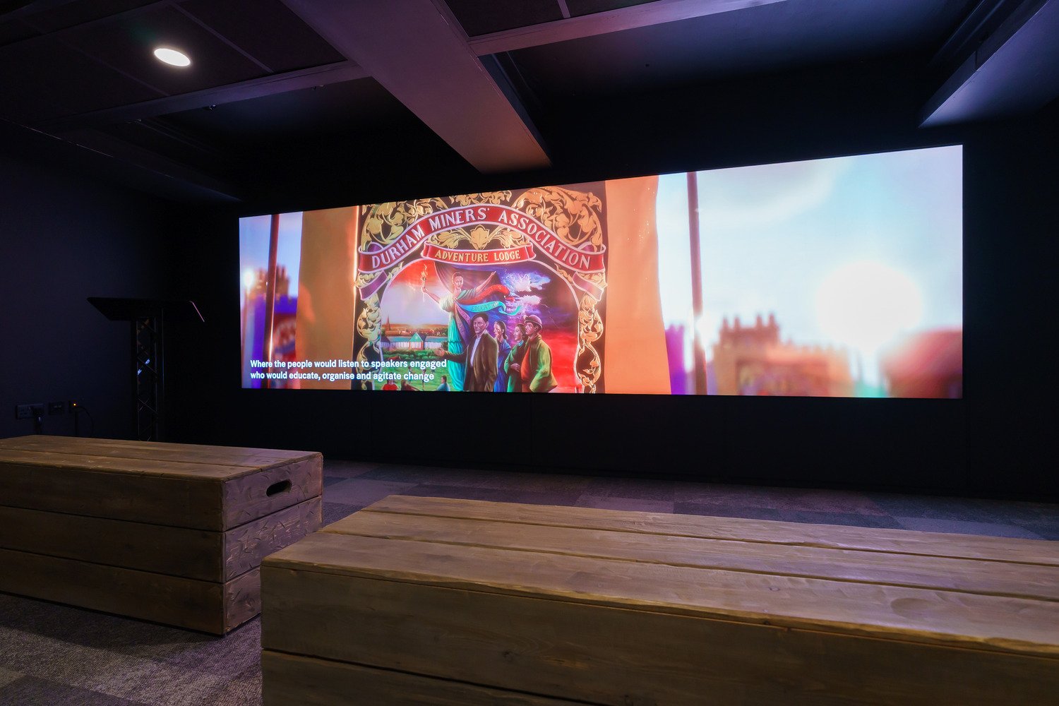 A video wall displaying media about mining heritage.