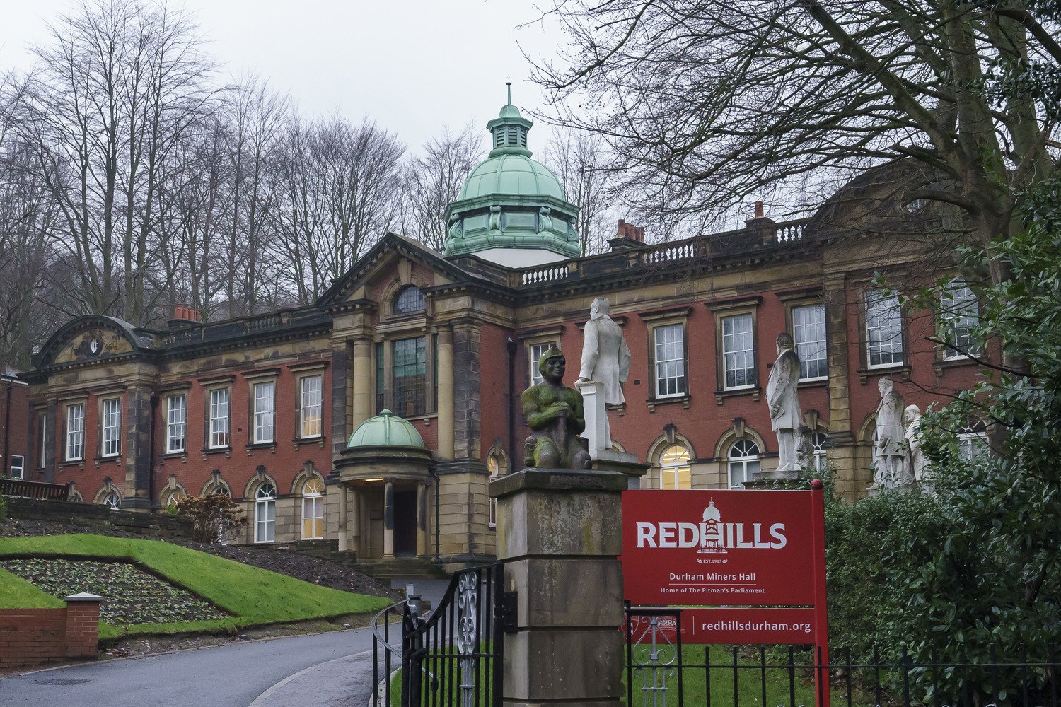 The exterior building and sign of the Redhills Durham Miners Hall