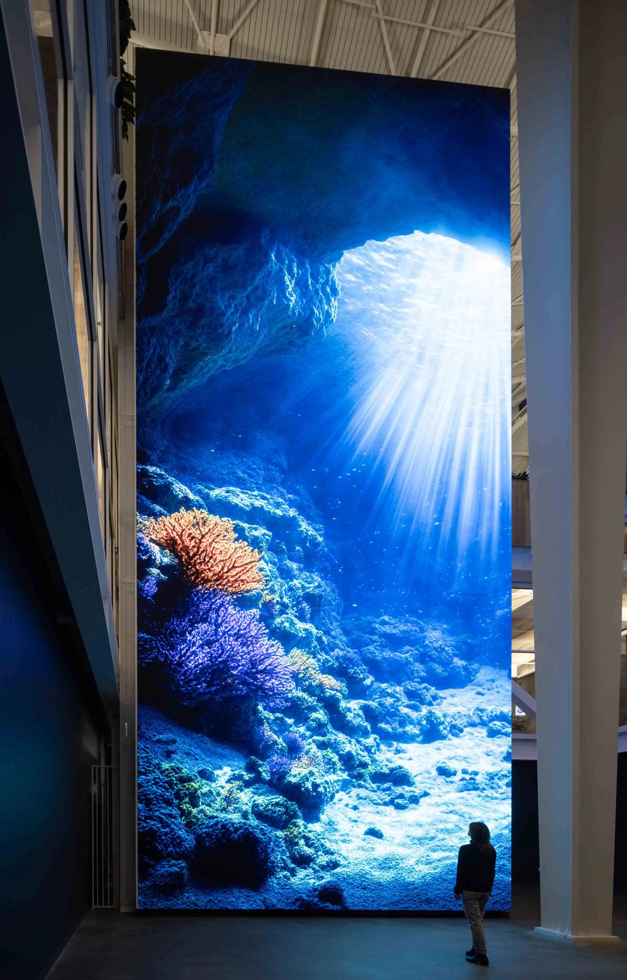 Refik Anadol Machine Dreams LED atrium showing ocean media.