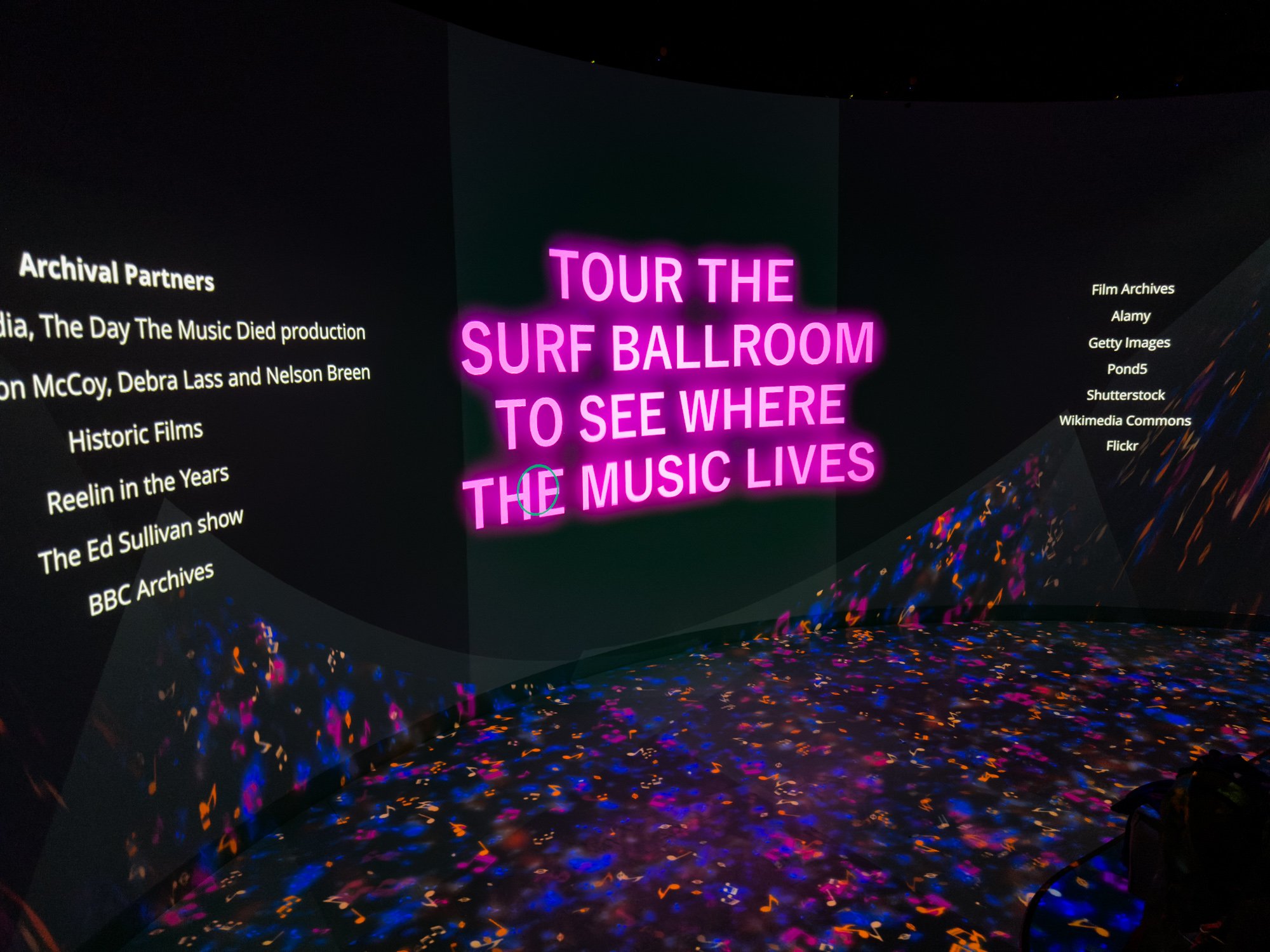Curved media projection wall with the title "Tour the Surf Ballroom to see where the music lives"