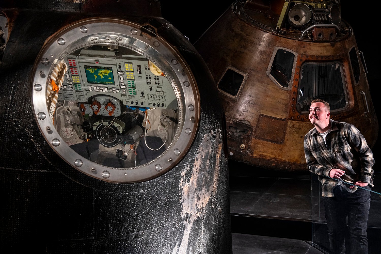 Man looking at ship exhibit.