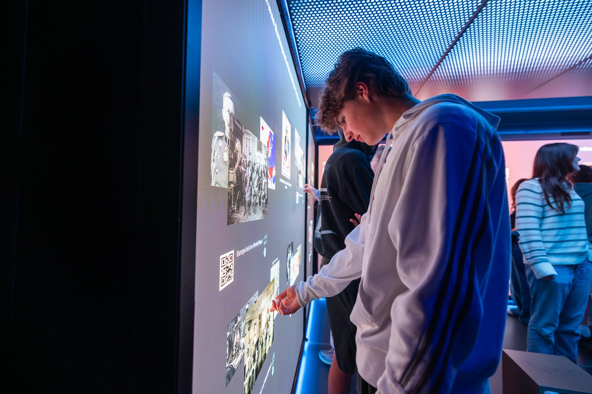 Kid interacting with touchscreen media.