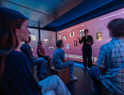 People viewing the front of the room.
