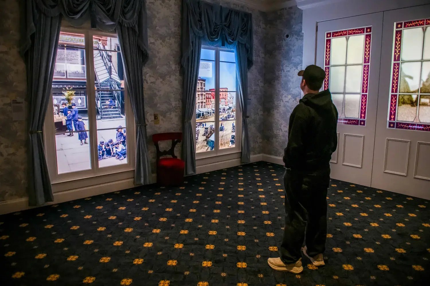 Man watching LED window displays.