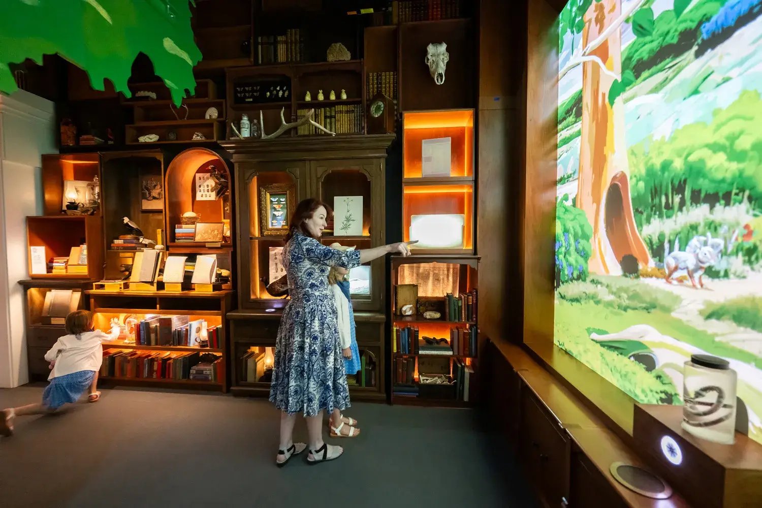 Woman pointing at projection on wall