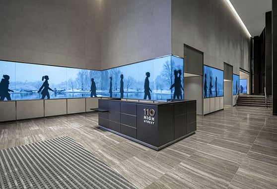 The sleek lobby of 110 High Street, showcasing a refined, modern aesthetic.