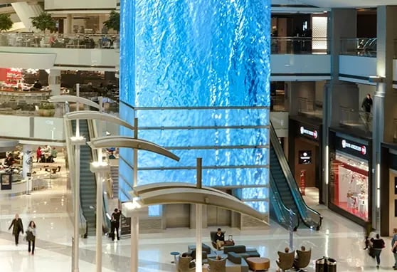 Towering LED display at LAX shows immersive visuals and real-time travel information.