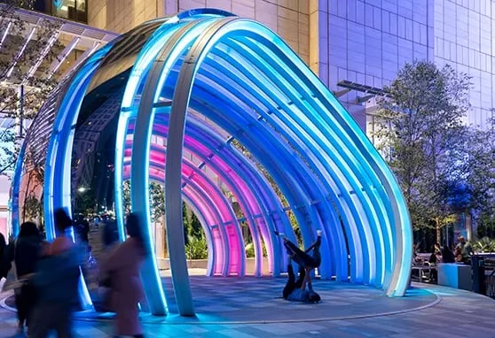 Two guests performing acrobatic moves within the large immersive Globe at the AT&T Discovery District in Dallas Texas.