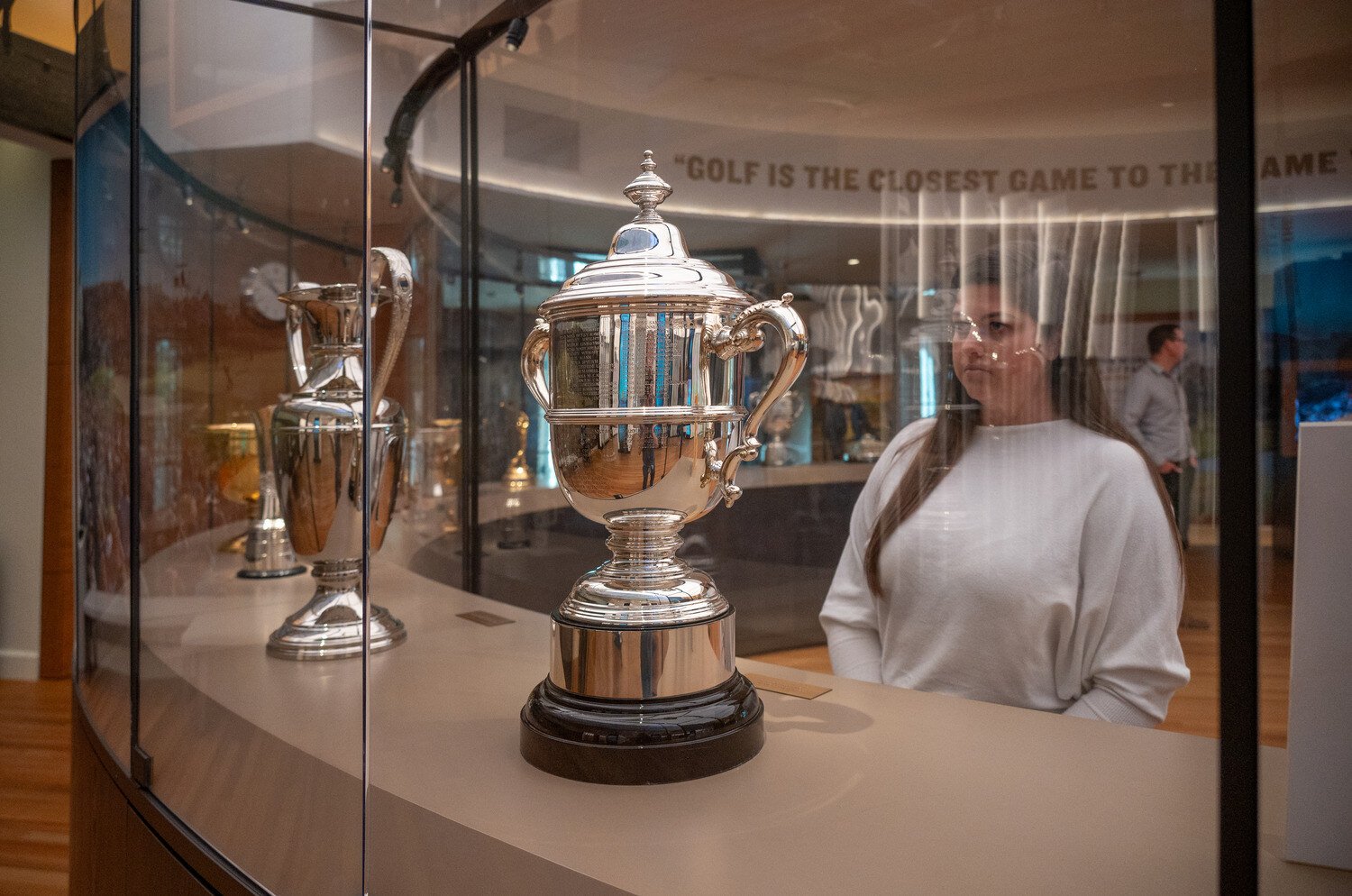 Woman looking at a trophy case