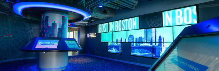 The finale space at View Boston which pairs interactive touch screens with a video wall. 