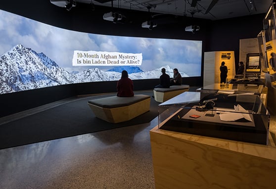 Visitors examine artefacts and digital content that tell the story of the hunt for Bin Laden at the National September 11 Memorial & Museum in New York City.