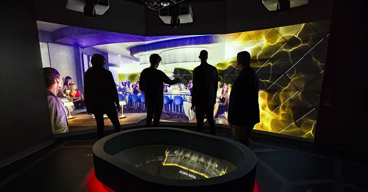 Visitors explore the Atlanta Hawks Preview Center, an interactive space showcasing the team’s future vision through engaging exhibits and branded environments.