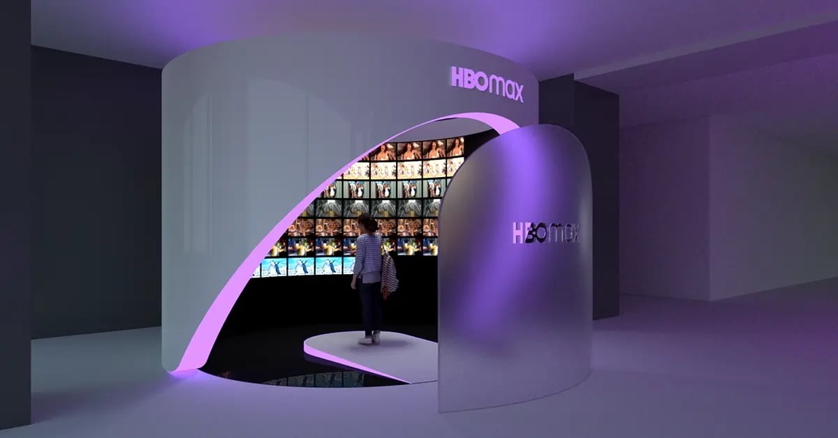 Visitors explore the HBO Max Orbit experience, where interactive displays and dynamic projection content showcase featured shows and characters in an immersive brand environment.