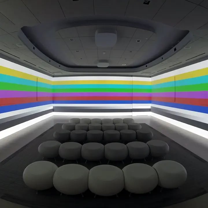 Visual representation of projector testing on three walls at an Electrosonic project.